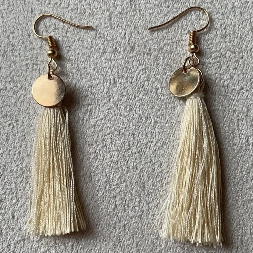 White tassel earrings + gold accent